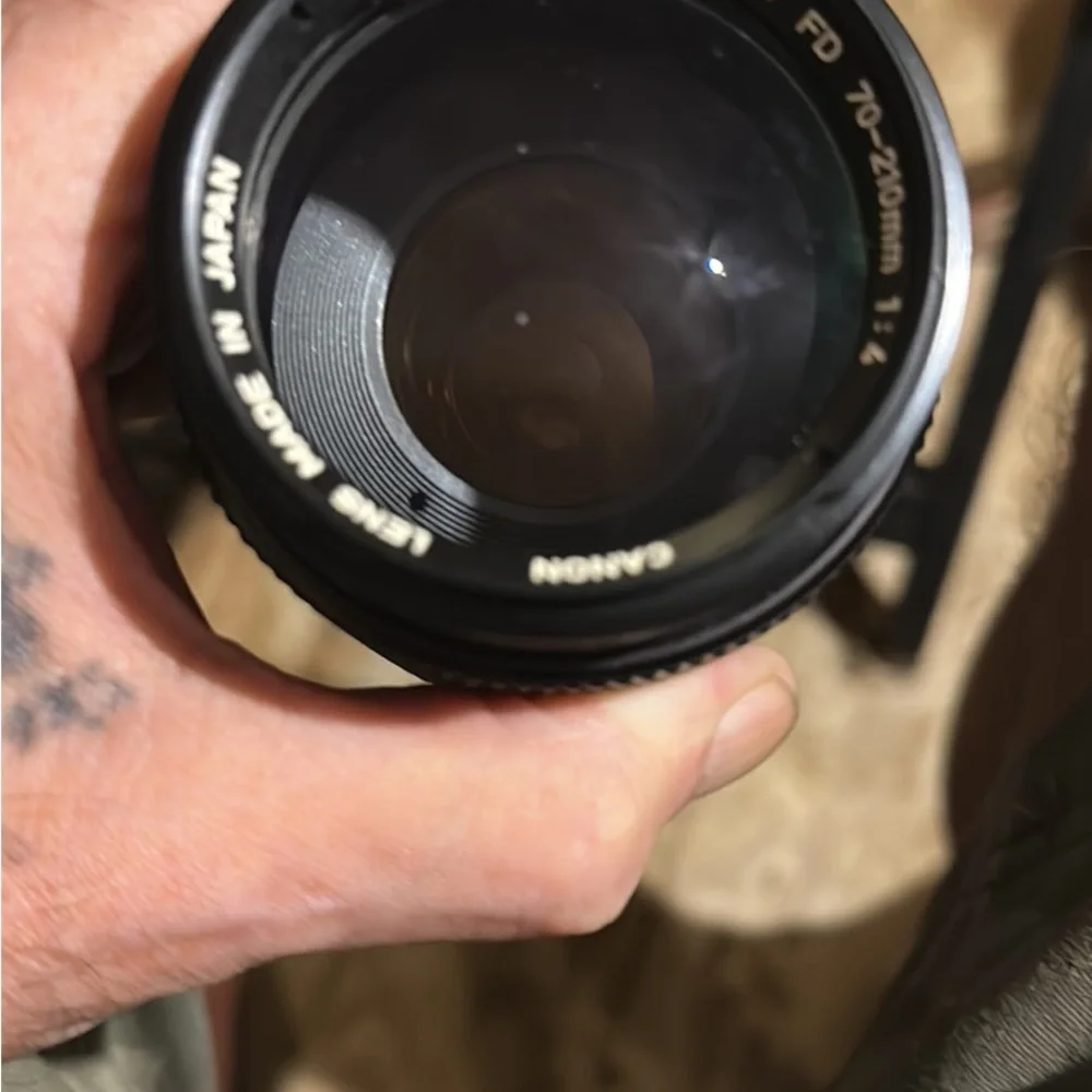 Two lenses one made by canon one made by prinz in box